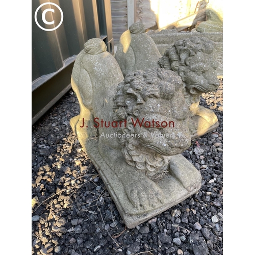 325 - A pair of cast concrete lion garden ornaments