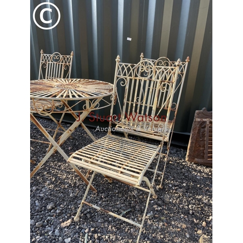 328 - A white painted metal garden table together with four folding chairs