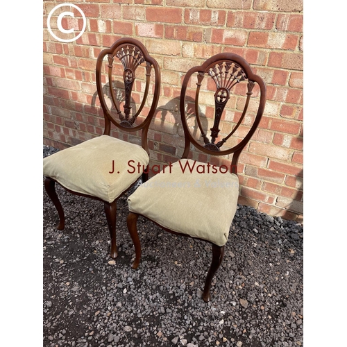 33 - A pair of mahogany hall chairs