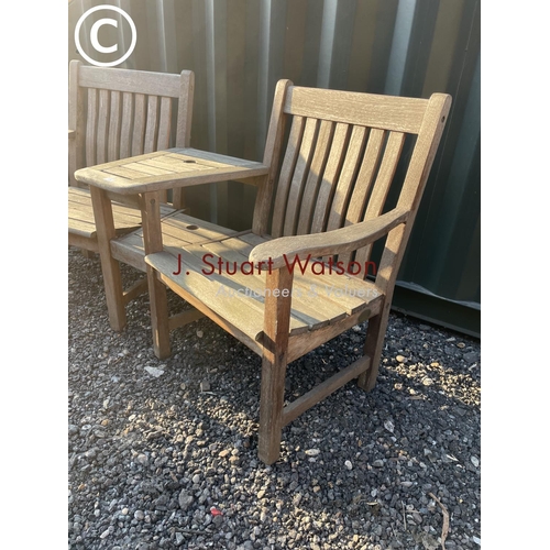 334 - A good quality hardwood garden love seat bench