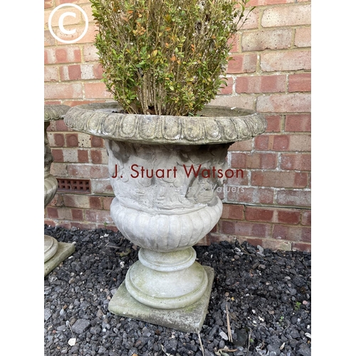 354 - A pair of good quality weathered concrete urn planters both decorated with cherub scenes 60high 50 d... 