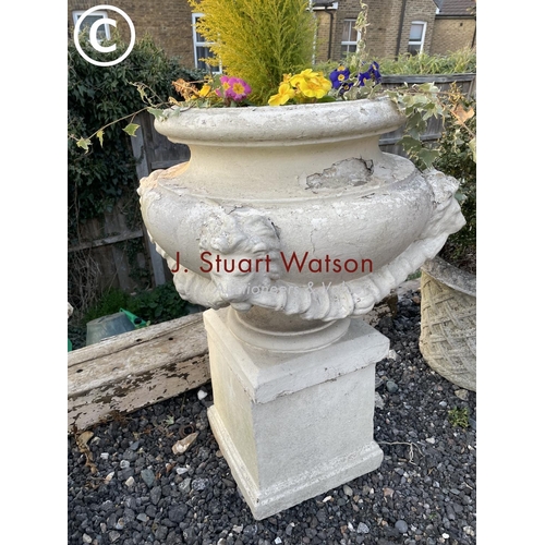 361 - A pair of impressively large painted concrete urn planters, each decorated with four lion heads and ... 