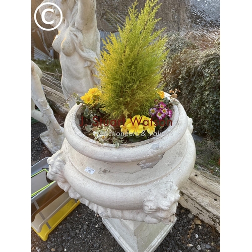 361 - A pair of impressively large painted concrete urn planters, each decorated with four lion heads and ... 