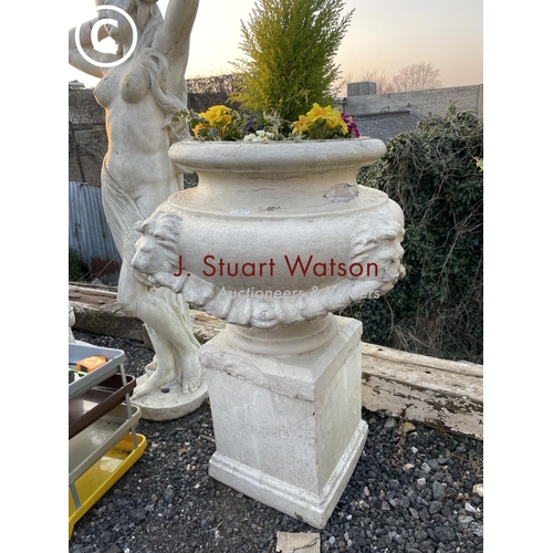 361 - A pair of impressively large painted concrete urn planters, each decorated with four lion heads and ... 