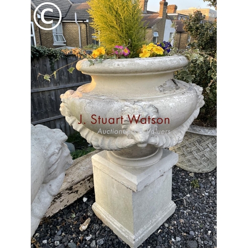 361 - A pair of impressively large painted concrete urn planters, each decorated with four lion heads and ... 