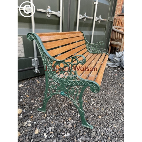 365 - A refurbished garden bench with green painted ironwork frame and slatted seat 126wide