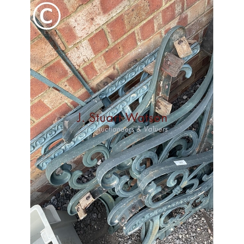 369 - A set of cast iron bench ends together with cast iron table legs