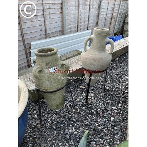 380 - Two grecian style urns on stands