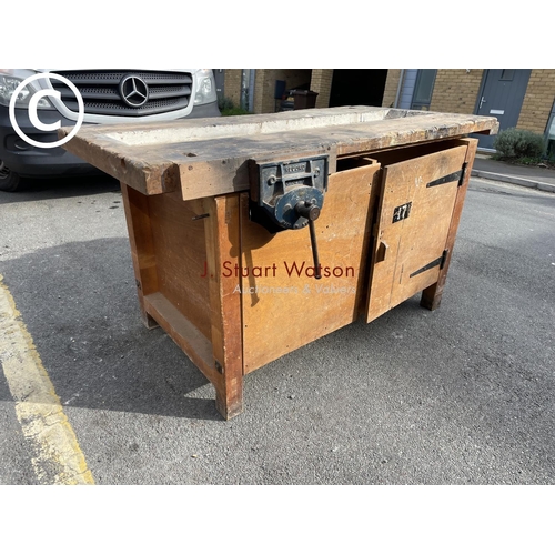 39 - A large vintage carpenters workshop bench fitted with vice and cupboard to each side 153x77x84