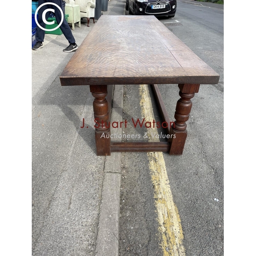 52 - A large oak refectory dining table 245x48x77