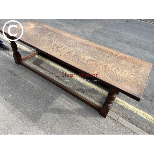 52 - A large oak refectory dining table 245x48x77