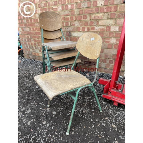 54 - A set of four metal and ply stacking school chairs