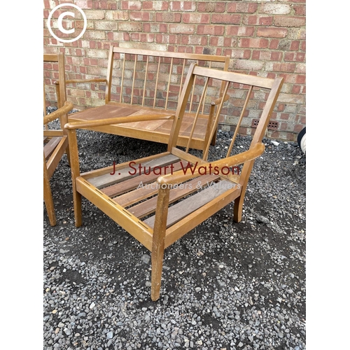 55 - A mid century teak lounge suite frame