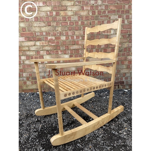 57 - A mid century, hand made oversize rocking chair