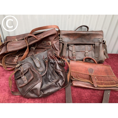 579 - 4 leather hold-all bags