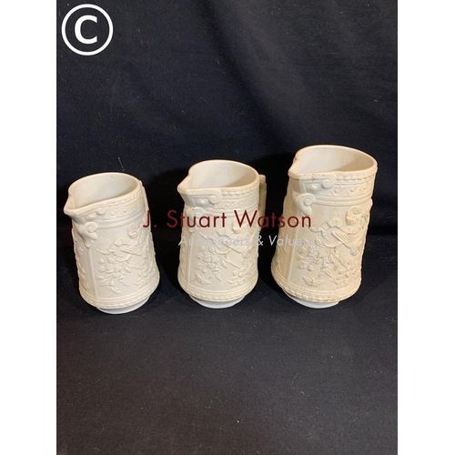 593 - Set of 3 graduated cream Wye jugs, tallest 20cms