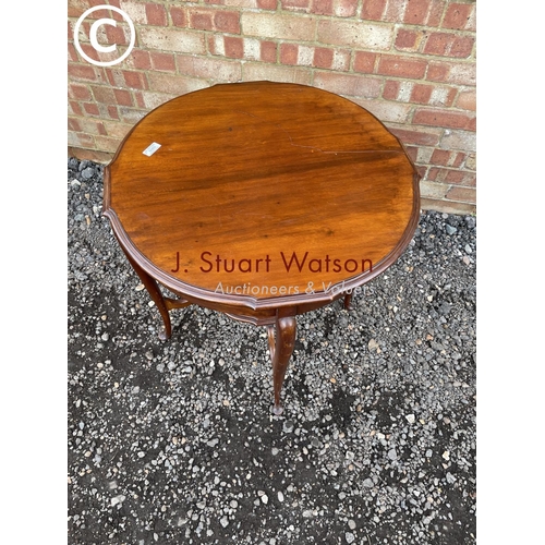 60 - A circular mahogany occasional table