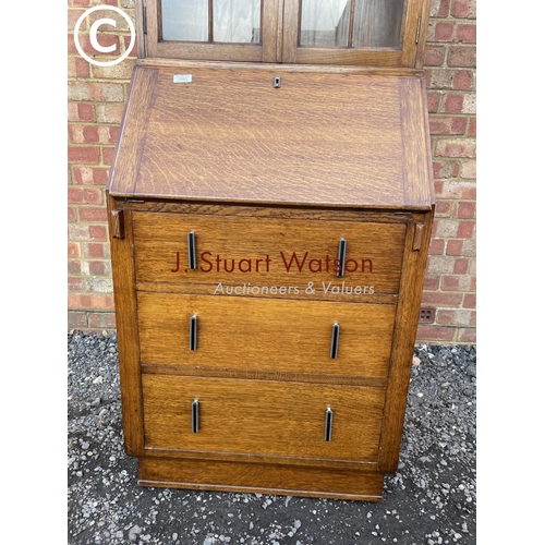 63 - A slim deco style oak bookcase bureau