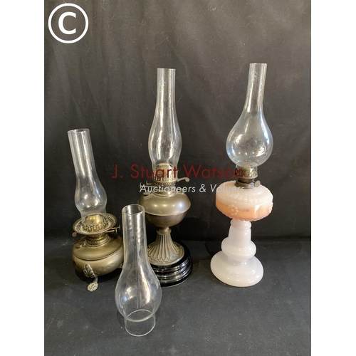 654 - 3 oil lamps and 1 spare chimney