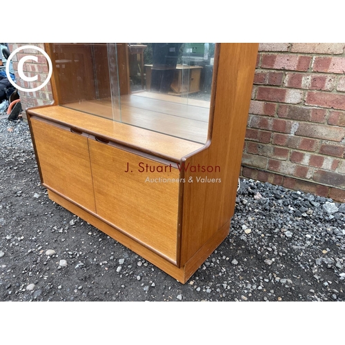 69 - A mid century teak cocktail lounge display cabinet 93cm wide