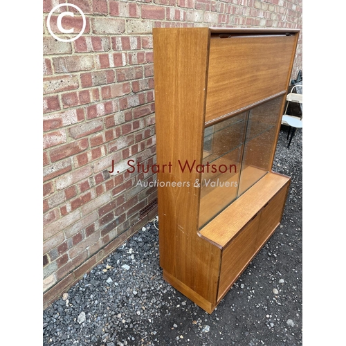 69 - A mid century teak cocktail lounge display cabinet 93cm wide