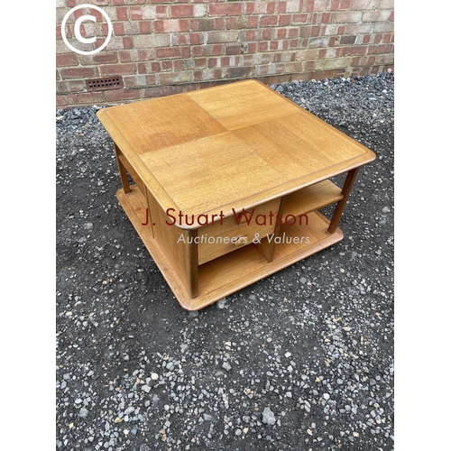 70 - A mid century teak coffee  table by nathan with two drawers, cupboard and shelves 77x77x48