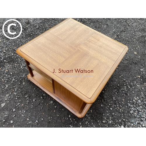 70 - A mid century teak coffee  table by nathan with two drawers, cupboard and shelves 77x77x48