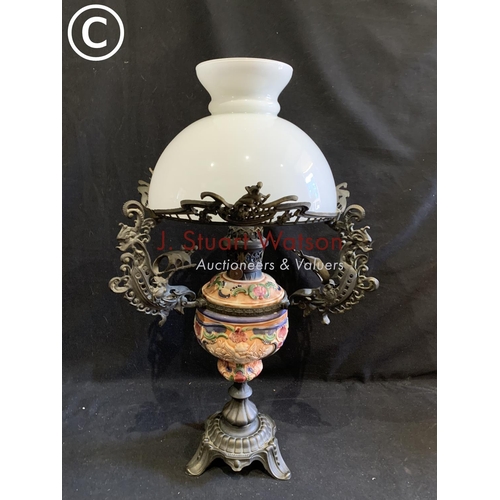 700 - Decorative china and metal oil lamp and shade, height 68cms