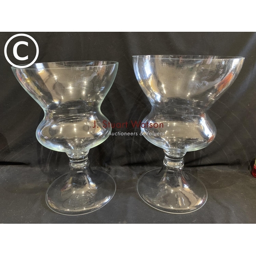 714 - 2  footed glass vases, height 62cms and 60cms, diameter 40cms,