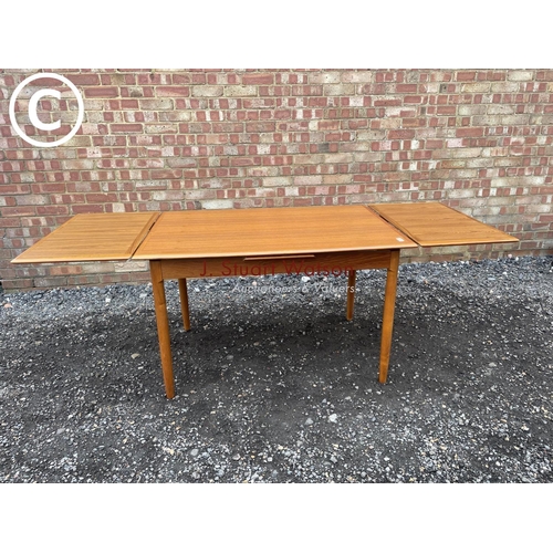 72 - A 1980's teak drawer leaf table made in Denmark by A.B.J