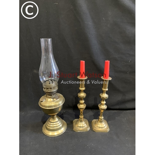 731 - Brass oil lamp and pair brass candlesticks