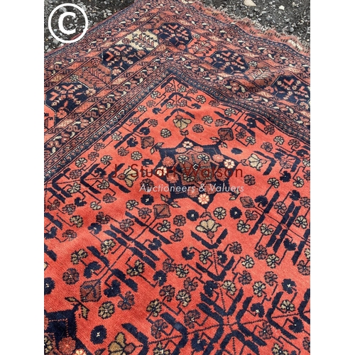 75 - A very large red pattern oriental rug 3.3x 2.3