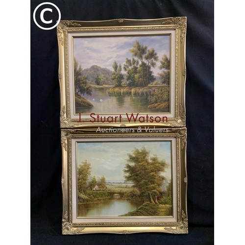 750 - Pair of gilt framed oil on canvas country scenes each 64 x 54 cms and gilt framed oil of wooded lake... 