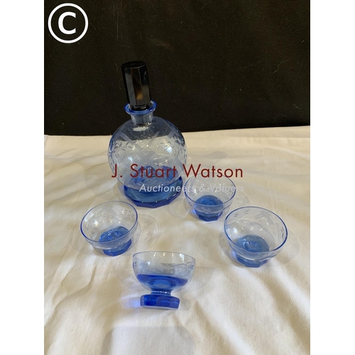 762 - Blue cut glass decanter height 21 cms and four matching glasses (no damage)