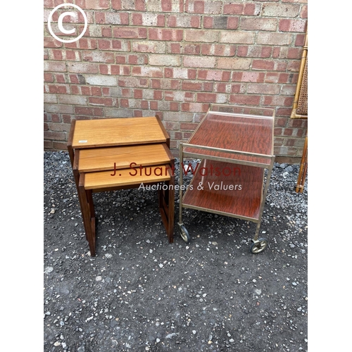 81 - A teak nest of three together with a retro tea trolley