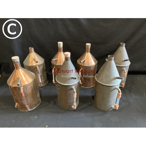 824 - Seven Copper vessels height 29 cms