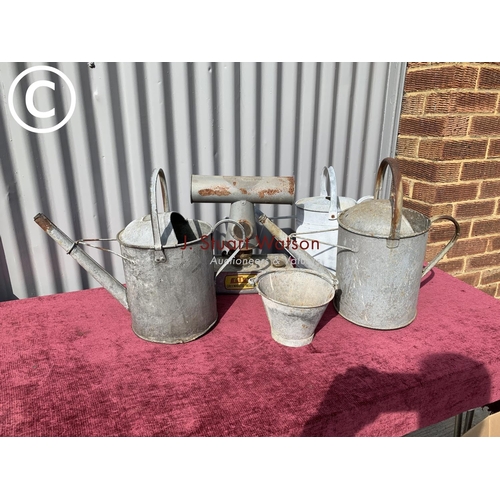 825 - Three galvanised water cans, Eltex greenhouse heater and small galvanised bucket