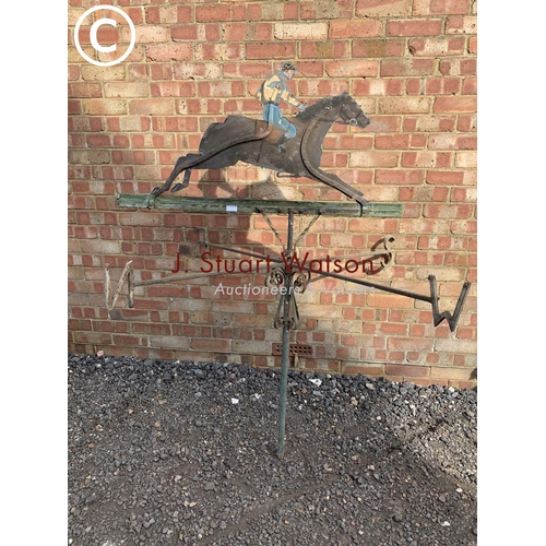 830 - Antique wrought iron weather vane with painted zinc figure depicting jockey on horse back,  height 1... 