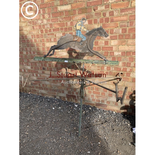 830 - Antique wrought iron weather vane with painted zinc figure depicting jockey on horse back,  height 1... 