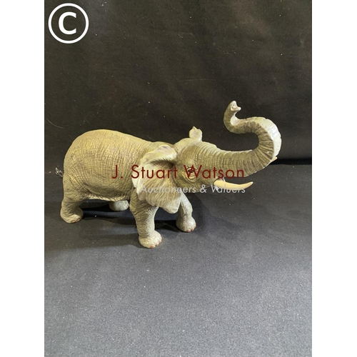 844 - Cold painted bronze model of an elephant height 22 cms, length 33 cms