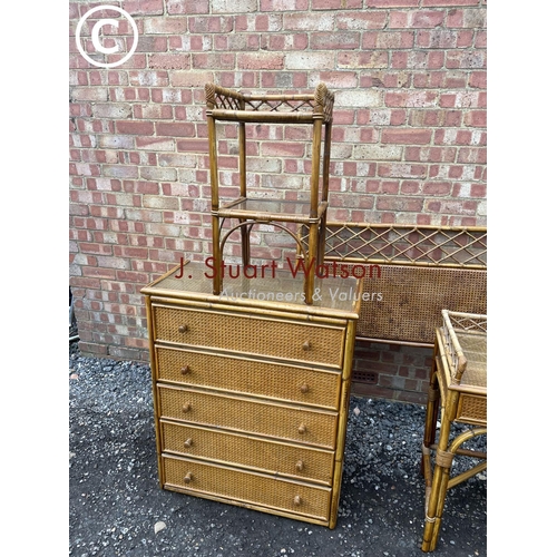 86 - A bamboo bedroom suite consisting of a chest of five drawers, three drawer dressing table, side tabl... 