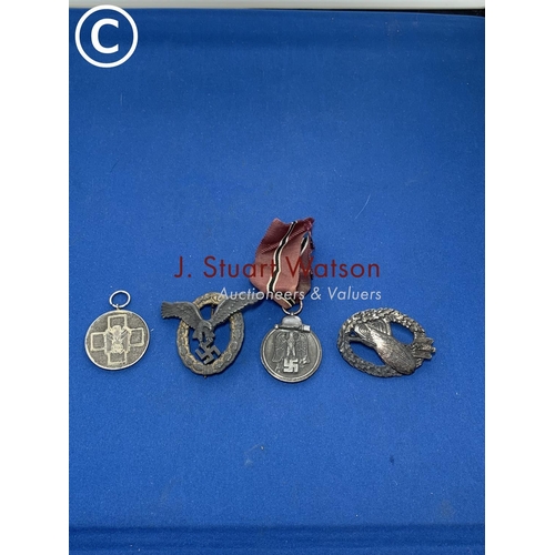 881 - Four German WW2 badges/medals