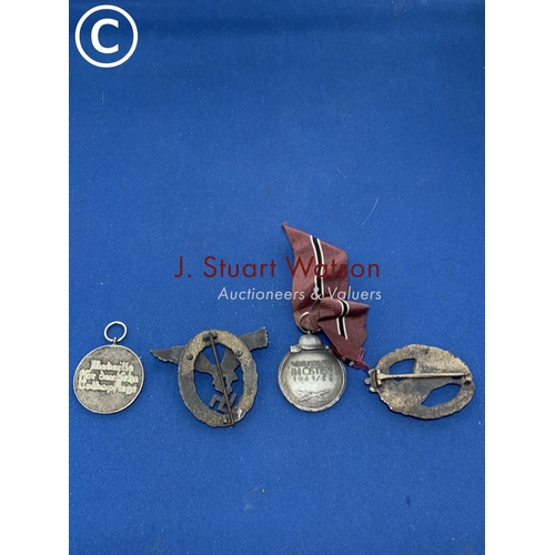 881 - Four German WW2 badges/medals