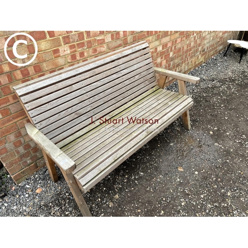 96 - A modern wooden garden bench