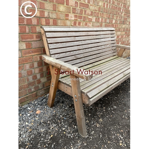 96 - A modern wooden garden bench