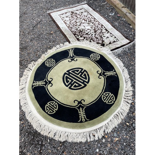 67 - Circular Chinese and a brown Chinese rug