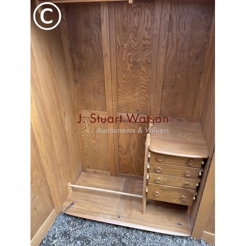 6 - An original ercol elm double wardrobe with a part fitted interior of four drawers (possible to disma... 