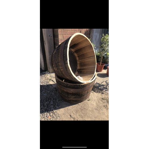 368 - A pair of Scottish oak half whiskey barrel planters