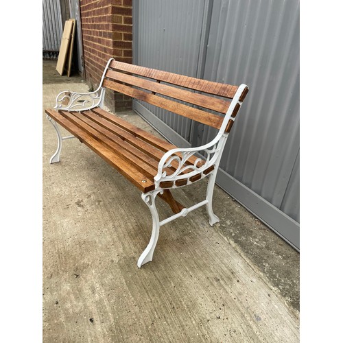 382 - A refurbished iron framed garden bench with varnished slatted seat