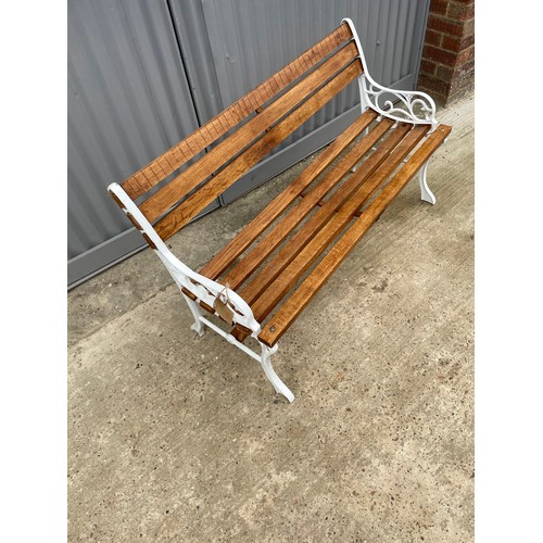 382 - A refurbished iron framed garden bench with varnished slatted seat